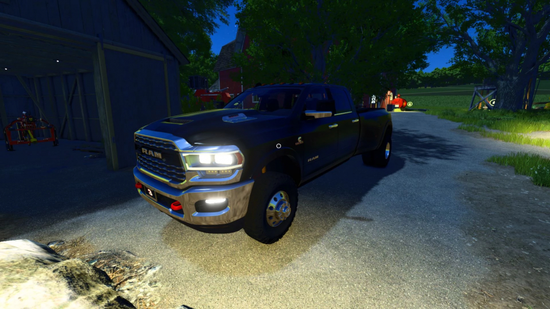 2024 Dodge Ram 3500 CrewCab mod in FS25 at night, parked beside a barn.