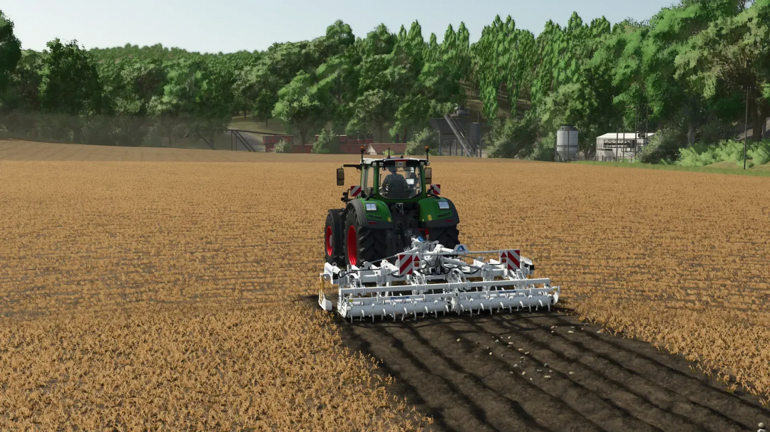 FS25 mod Alpego kExtreme 500 Plow in use, showing a tractor plowing a field surrounded by trees.