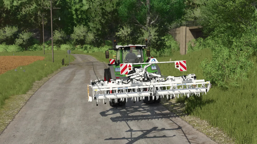 FS25 mods: Alpego kExtreme 500 Plow attached to a tractor on a rural road.