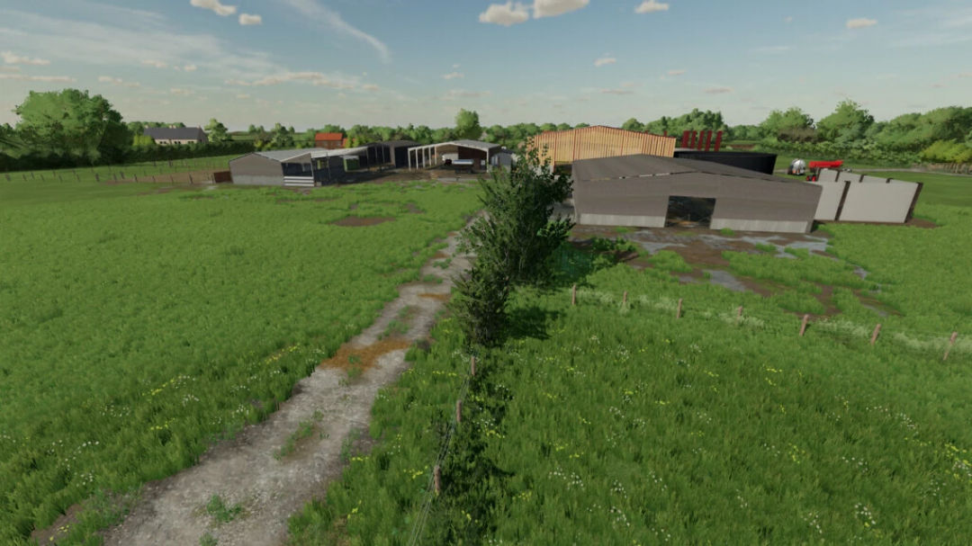 FS22 mod Ballam Rd Dairy Farming v1.2.3.0 showing a lush green farm with several barns and trees in Farming Simulator 22.