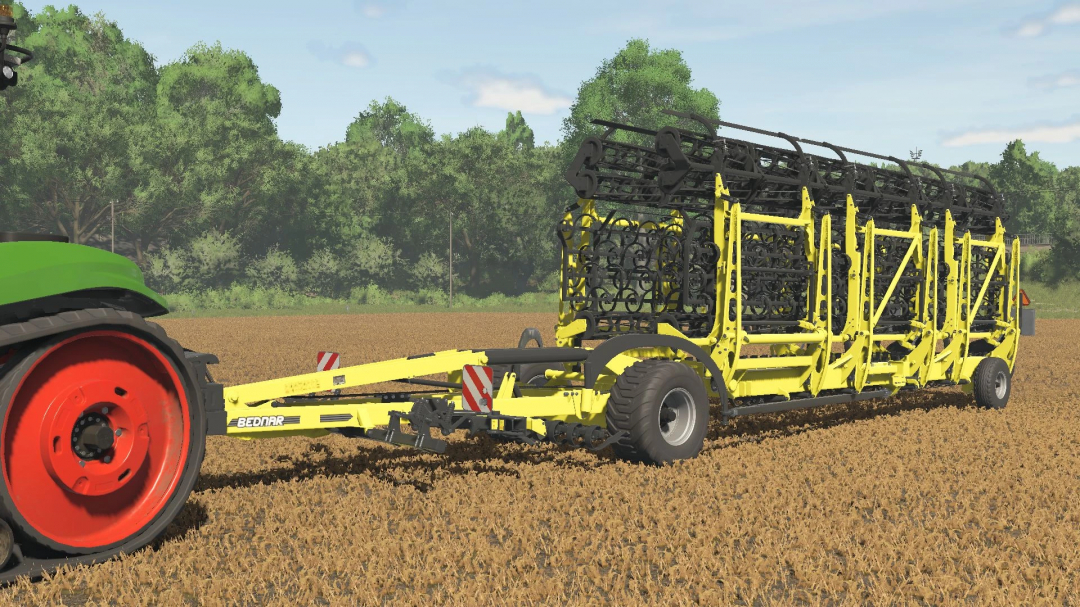 FS25 mod Bednar SWIFTER SM 18000 v1.0.0.0 depicted in a field, showcasing its large yellow frame and wheels.