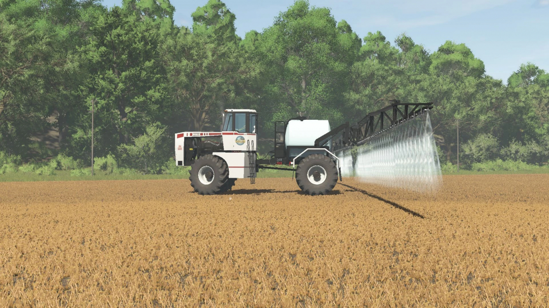 FS25 mod Big Brute v1.0.0.0 spraying in a field with trees in the background.