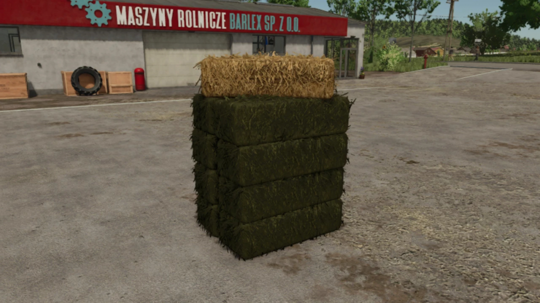 Buyable Small Bales mod for FS25 showing stacked hay bales in front of a building.