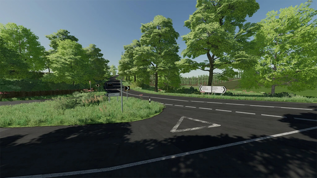 Chadlington Map v1.0.1.0 for FS22 features a lush green landscape with a crossroads and street signs, enhancing the Farming Simulator 22 experience.