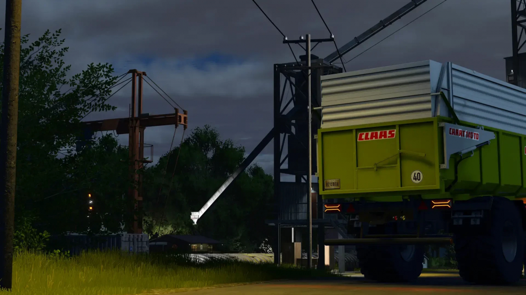 FS25 mod Claas Carat 140TD trailer at night with industrial background, highlighting farming equipment.