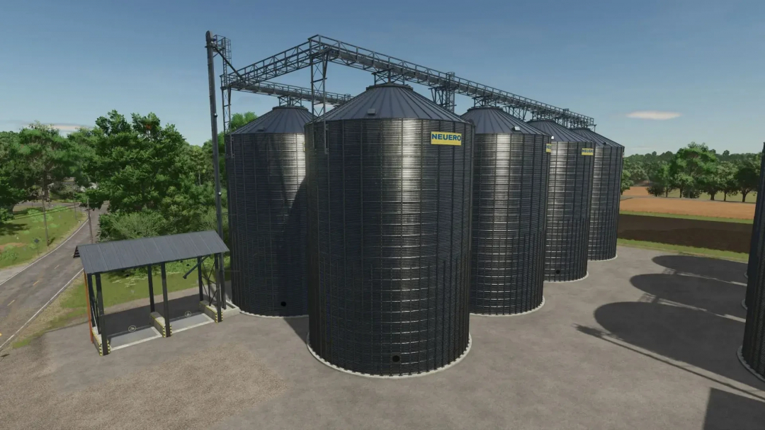 FS25 Multifruit Silo mod showcasing large steel silos in Farming Simulator 25.