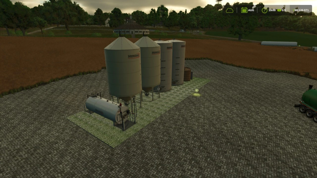 FS25 mods: Storage Distribution by Anaxandros v1.0.0.0 with large silos in a field.