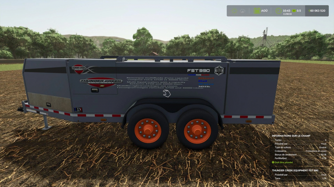 FS25 mod Fst990 Multi liquid trailer in a field, showcasing its design and capacity features.