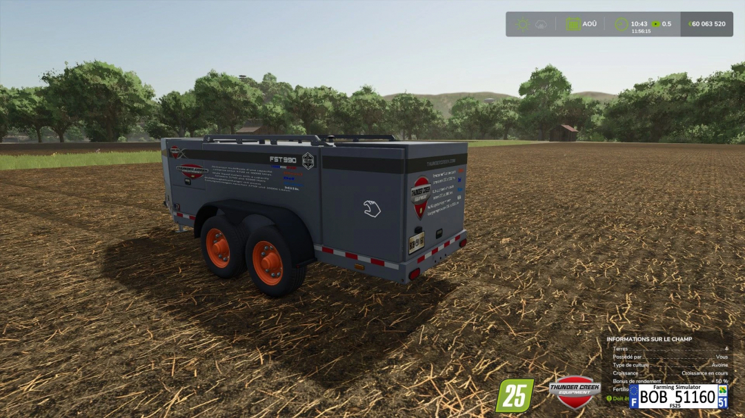 FS25 mod Fst990 Multi liquid v1.0.0.0 showcased in a field, featuring a trailer with orange wheels in Farming Simulator 25.