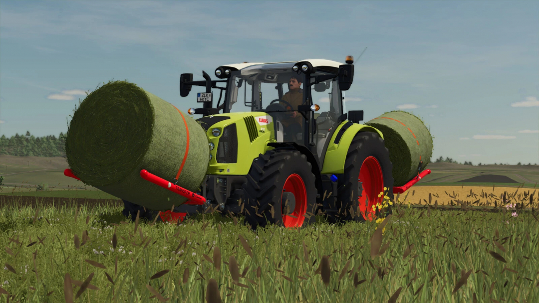 Tractor with hay bales using Gorenc Transfer Pack mod in FS25.