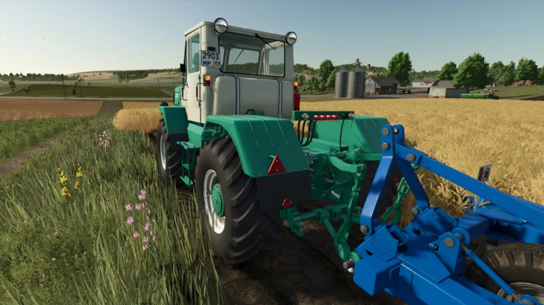 FS25 mod HTZ T-150K v1.0.0.0 tractor in field, showcasing Farming Simulator 25 machinery.