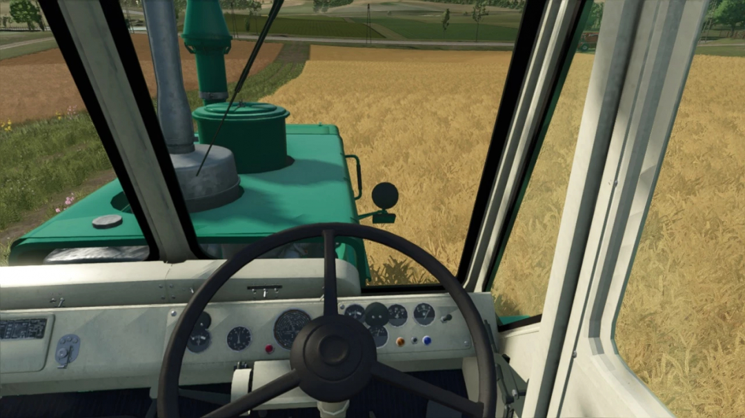 Interior view of HTZ T-150K tractor in FS25 mod, showing steering wheel and dashboard in a wheat field.