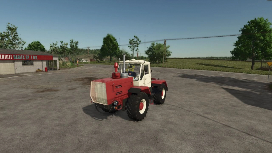 HTZ T 150K V8 tractor mod in Farming Simulator 25, showcasing its design in a rural setting.