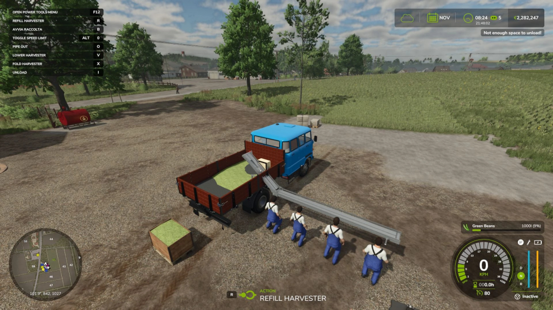 FS25 mod Ifa Double Cabin Brigade Multifruit v1.0.0.0 showing a blue truck unloading green crops with workers nearby.