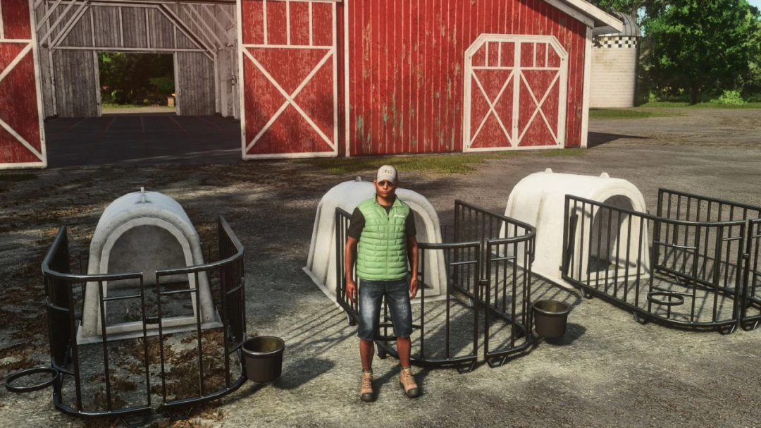 FS25 mod Igloo Calves v1.0.0.0 showing calf hutches and a character standing nearby in front of a barn.