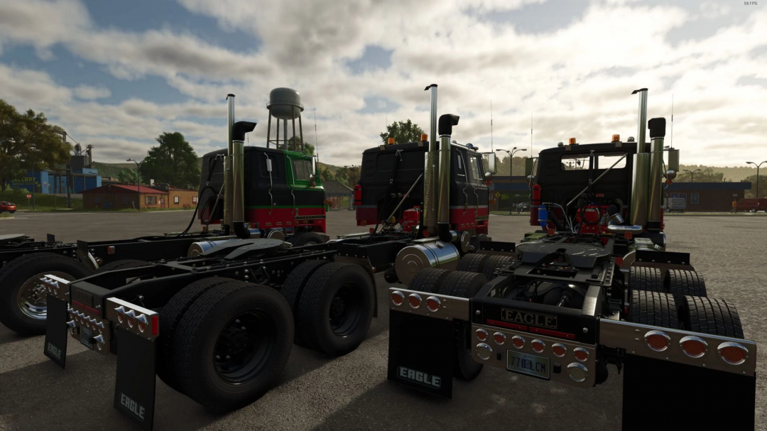 FS25 mod International Transtar II Eagle v2.0.0.0 featuring three detailed trucks parked in a lot.