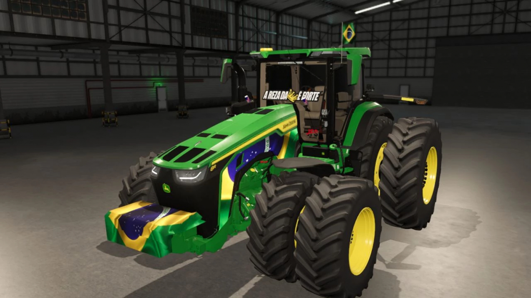 John Deere 8R BR mod in FS25 game, featuring Brazilian flag design, in a warehouse setting. FS25 mods.