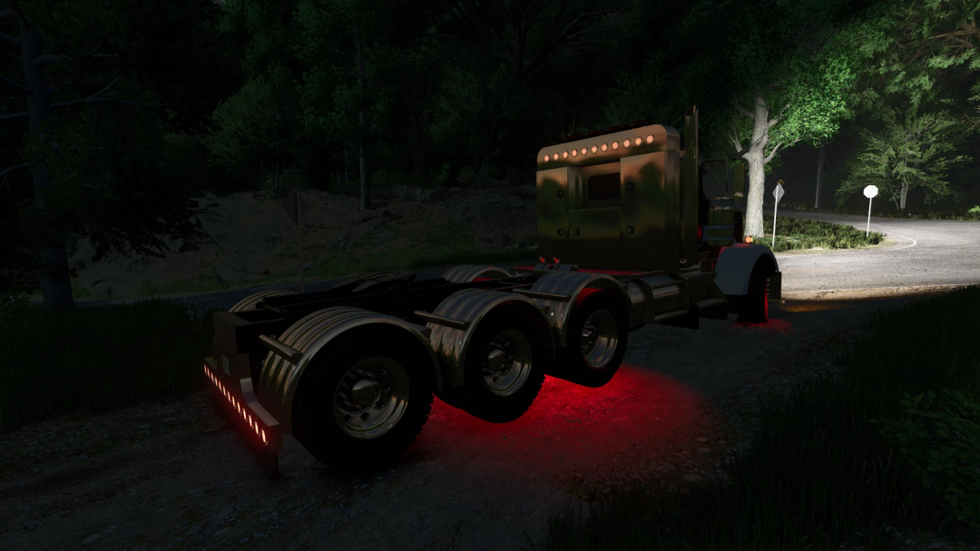 Kenworth W900L truck mod for FS25 with glowing red lights at night on a forest road.