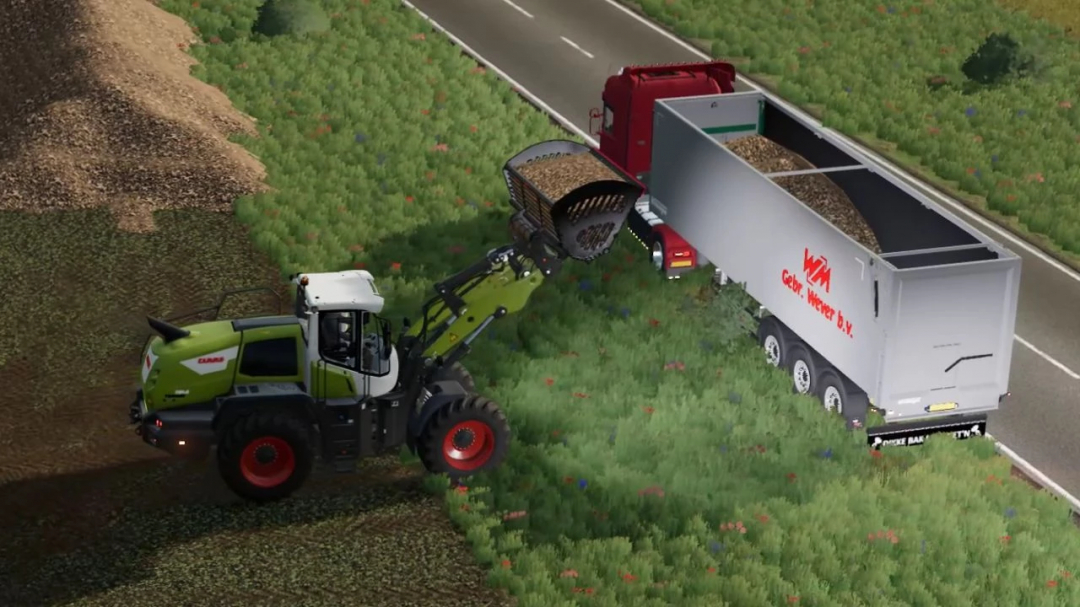 FS25 mod Krampe Tipper Trailer v1.0.0.0 being loaded by a loader on a farm road.