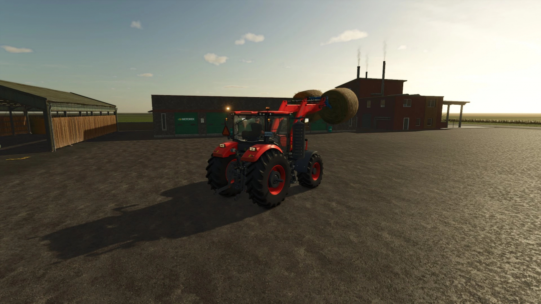 Kubota M8-Series tractor mod lifting hay bales in FS25 farmyard, Farming Simulator 25 mods.