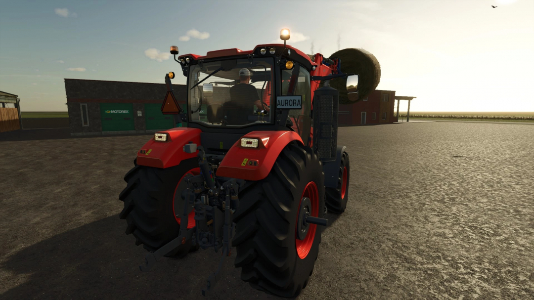 Kubota M8-Series tractor mod in FS25, hauling a bale with a sunny background.