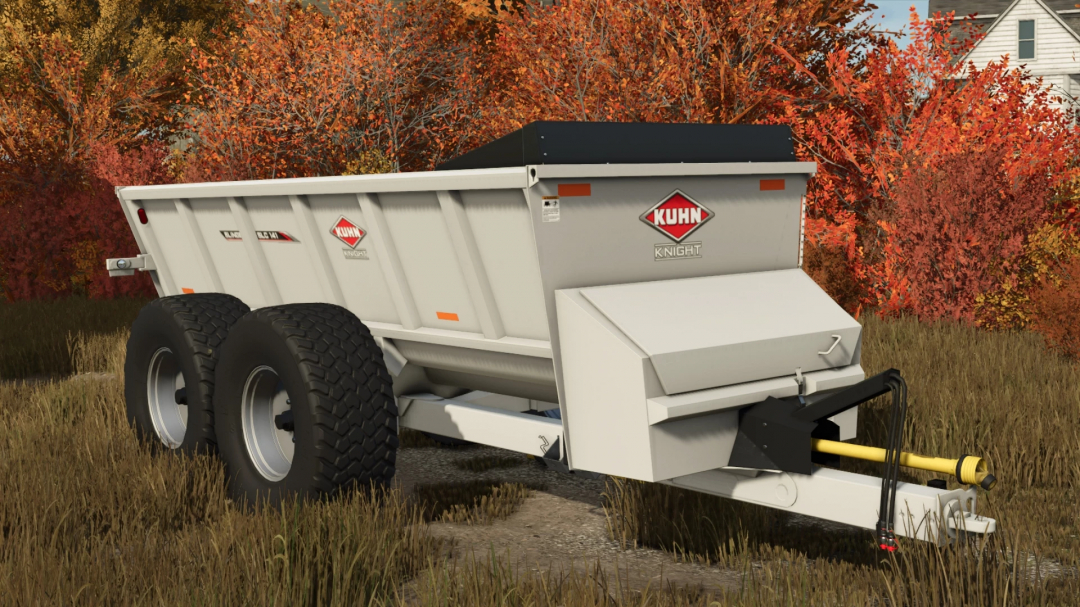 Kuhn SLC141 trailer mod for Farming Simulator 25, featuring a robust design with dual wheels, surrounded by autumn foliage.