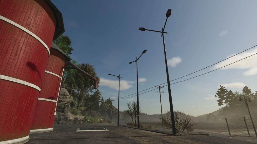 FS25 mods showcase the Modern Floor Lamp Pack v1.0.0.0, featuring tall streetlights beside a red silo in a rural setting.