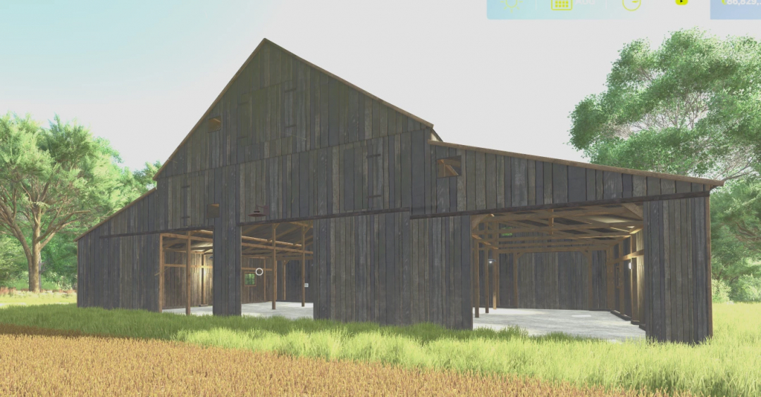 Old barn mod from FS22 in Farming Simulator 25, showcasing a rustic wooden structure in a grassy field.