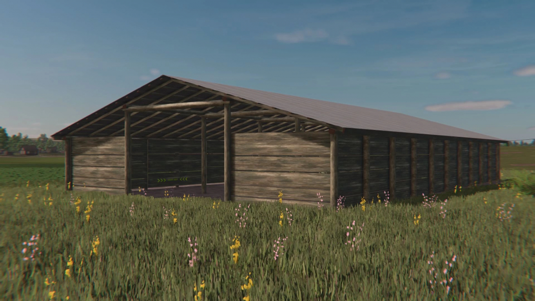 FS25 mod Old Wooden Shed v1.0.0.0, a rustic barn amidst a field of wildflowers in Farming Simulator 25.