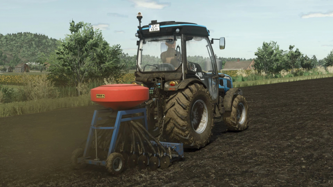 FS25 Olt Gama Pack v1.0.0.0 mod showcasing a blue tractor with a red seeder on a farm field.