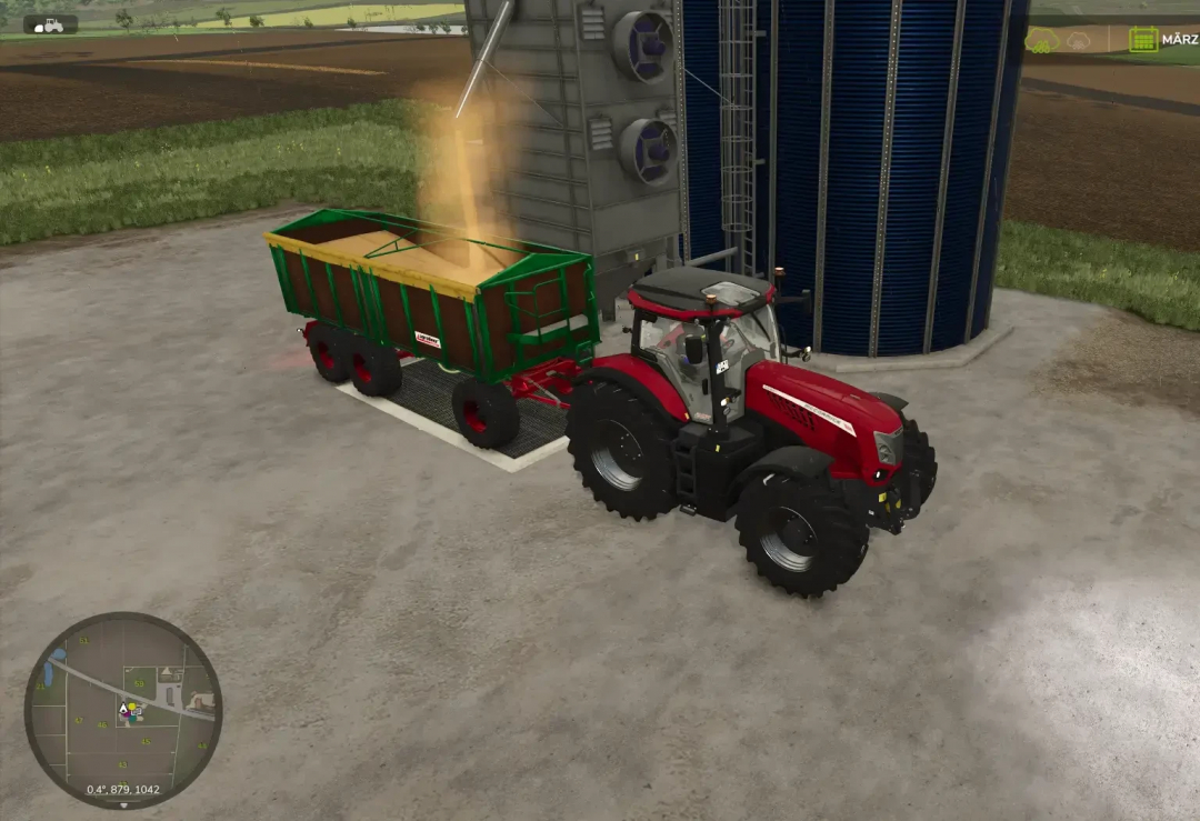 FS25 mod Retro Kröger HKD 402 3-axle trailer unloading grain at a farm silo.