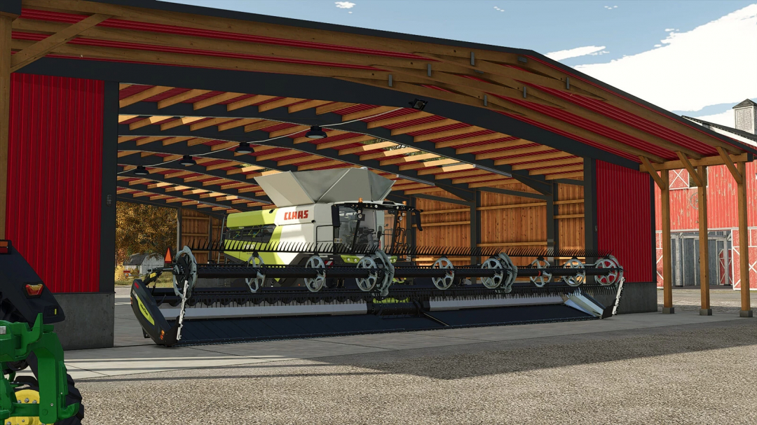 Wide Garage mod in FS25, showing a large shed with farm equipment inside.