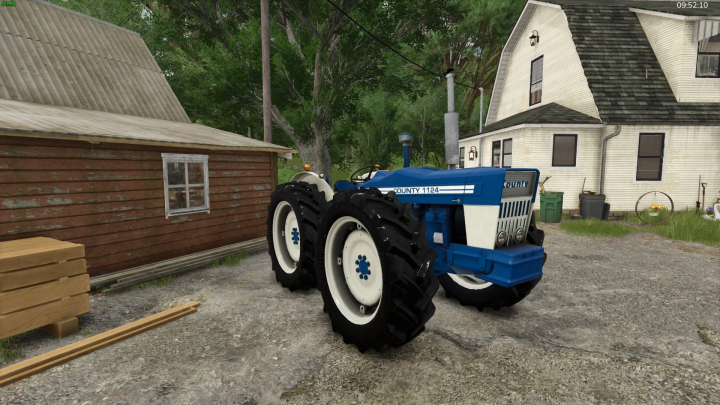 fs25-mods,  County 1124 tractor mod in FS25, parked near rustic buildings.