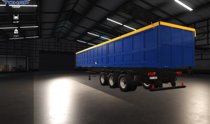 fs25-mods,  FS25 Tonar v1.0.0.1 mod showcasing a blue and yellow trailer in a warehouse setting for Farming Simulator 25.