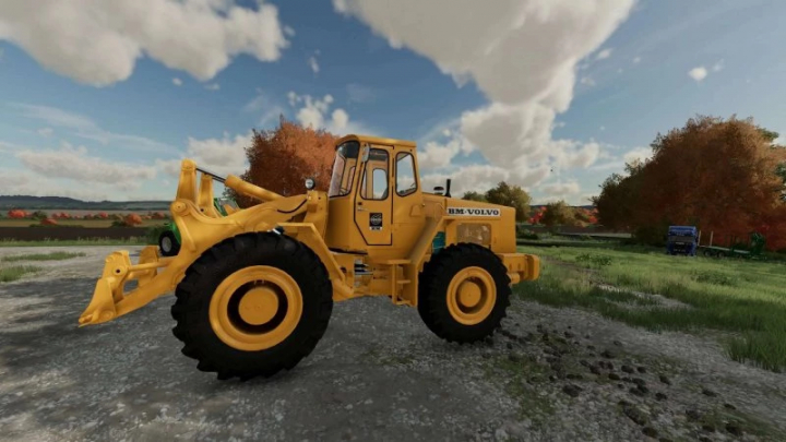 fs25-mods, FS25 Volvo LM 845 mod for Farming Simulator 25, showing a yellow loader in a scenic outdoor setting.