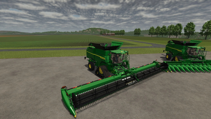 fs25-mods,  John-Deere S7 Modifiée v1.0.0.0 FS25 mods, featuring green harvesters in a field ready for Farming Simulator 25.