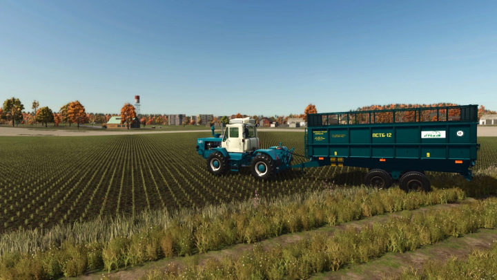 fs25-mods,  FS25 mod PTSB-12/17 v1.0.0.0 showcasing a tractor and trailer in a large field under a clear sky.