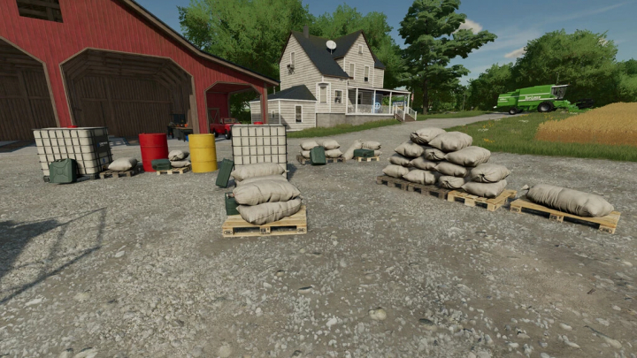 fs22-mods, FS22 Placeable Filling Stations mod featuring various storage items near a barn and farmhouse.