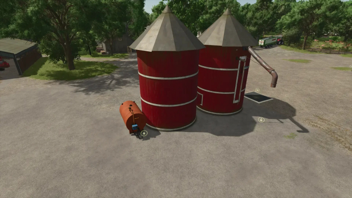 fs25-mods,  Two red silos with a small tank in Farming Simulator 25 Production Pack mod, enhancing farm production capabilities.