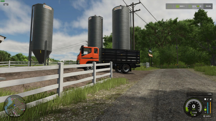 fs25-mods,  FS25 Shop Station mod v1.0.0.0 showing silos, orange truck by fence on a rural road.