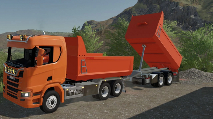 fs22-mods, FS22 Zetterbergs Pack mod features an orange dump truck with elevated trailer against a mountain backdrop.