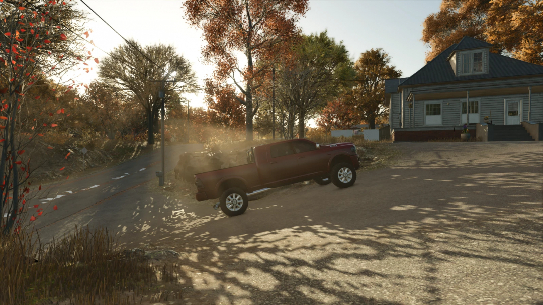 2024 Dodge Ram Mega Cab mod for FS25 in a rural setting with autumn foliage.