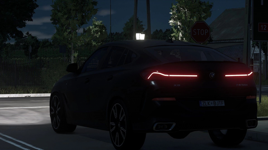 Night view of BMW X6 M-Sport 2020 mod in FS25 with taillights illuminated, showcasing detailed vehicle design.