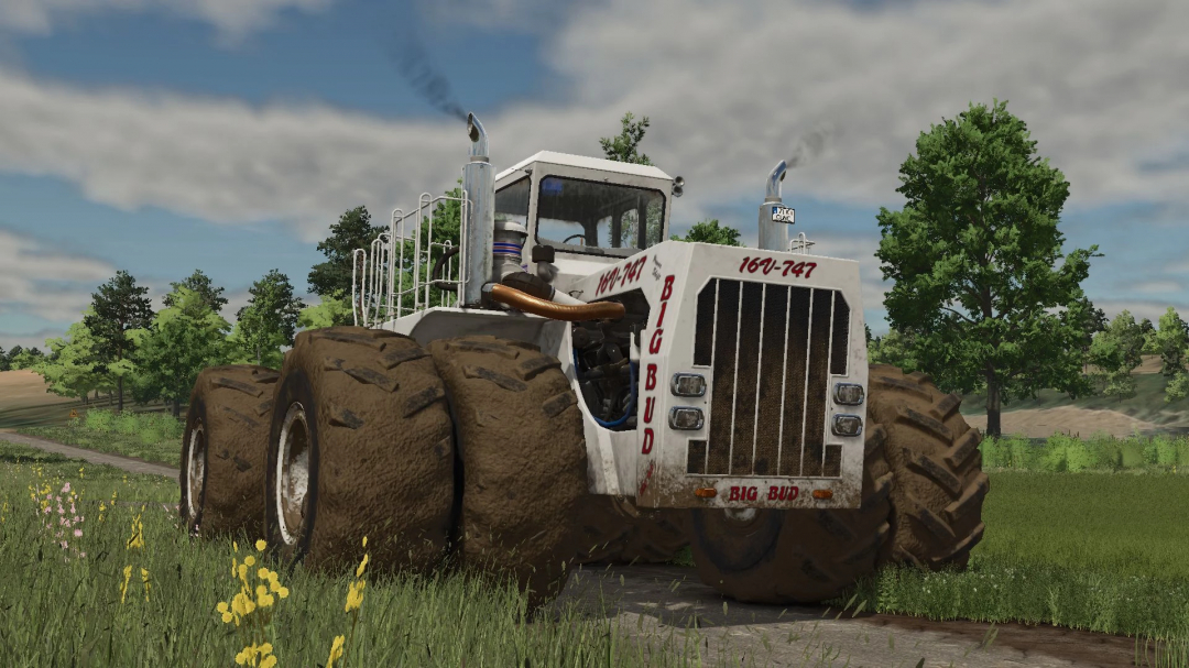 Big Bud 747 tractor in FS25 mod, showcasing large muddy tires and white exterior on a rural road.