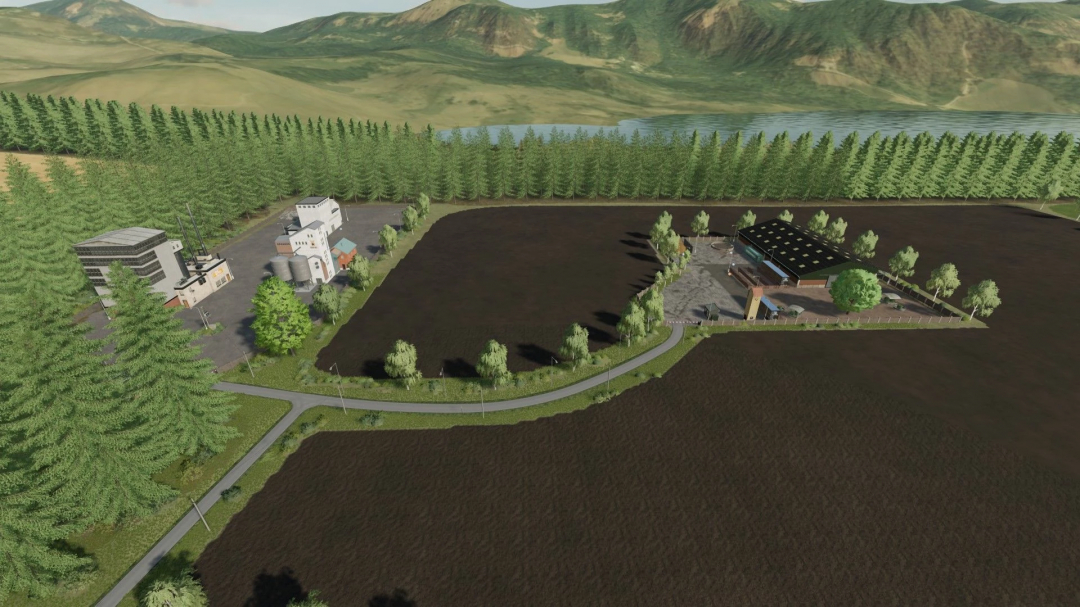 Aerial view of Bohemia Country mod in FS22 featuring farmland, trees, and industrial buildings against a mountainous backdrop.