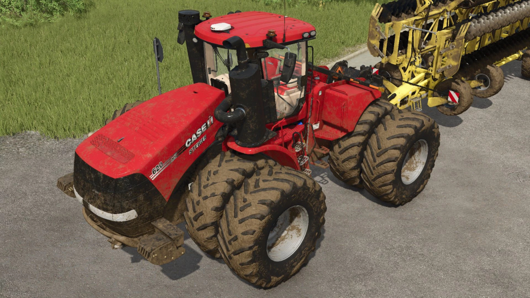 Case Steiger 4WD tractor mod in FS25, featuring a red design and large tires on a farm road.