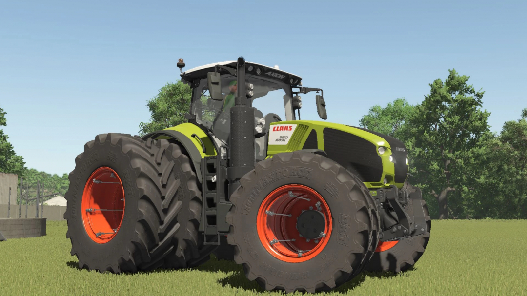 Claas Axion 900 mod in Farming Simulator 25, showcasing a green tractor with dual rear wheels on grass.