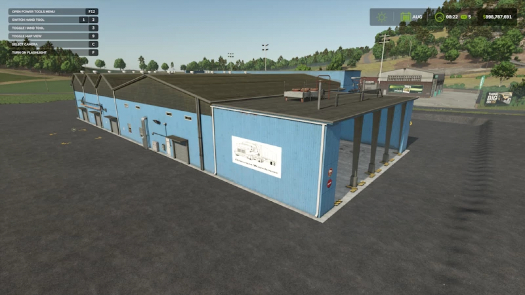 FS25 mod Discount Warehouse v1.0.0.1, showcasing a large blue warehouse in a rural setting.