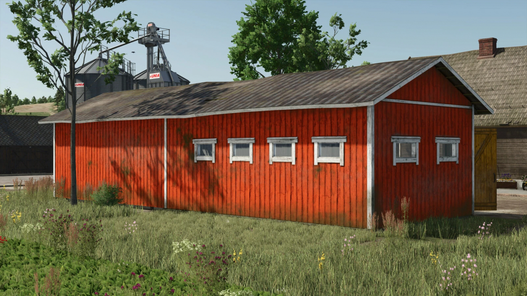 Finnish Machinery Sheds mod in FS25, showcasing a red wooden shed with small windows in a rural setting.