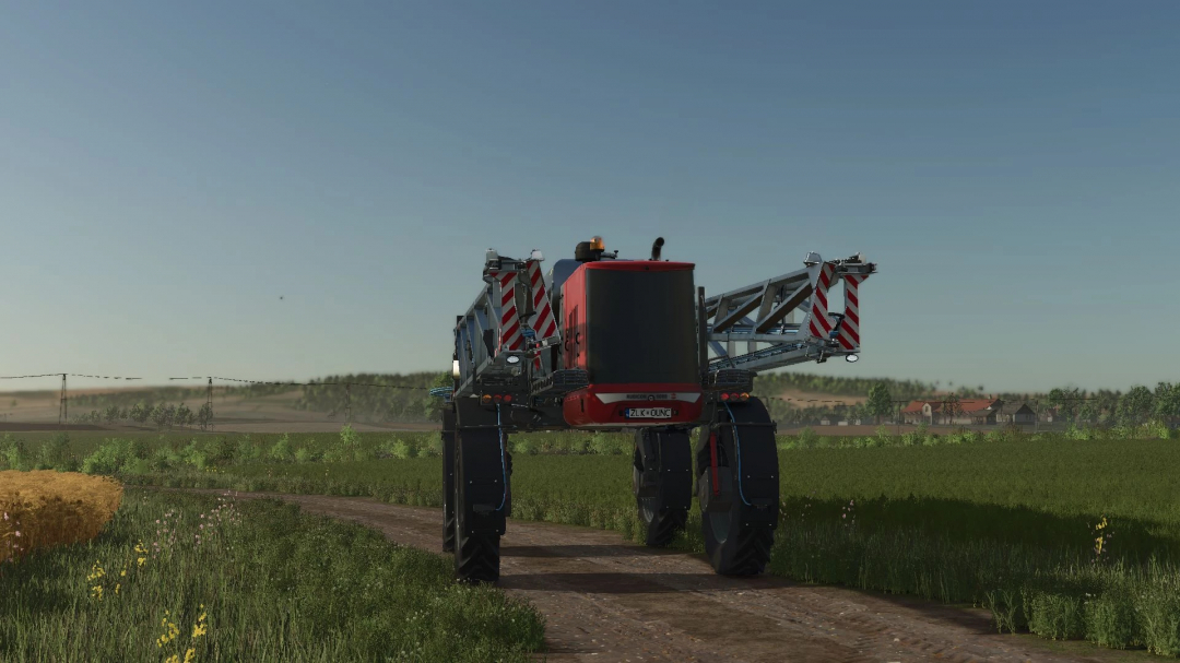 Hardi Rubicon 9000 in FS25 mod showcasing a sprayer on a dirt road in a rural landscape.